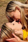 Two sexy blonde teens have lesbian sex outdoors