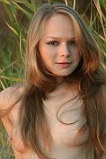 Gorgeous teen gets naked outdoors
