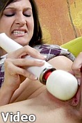 Sexy teen Simone masturbates with the massager on her clit