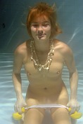 Daring redhead Katerina C takes off her panties underwater at Met Art