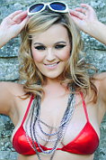 Jodie Gasson teases in a tiny red bikini
