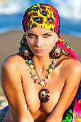 Stunning babe posing on the beach