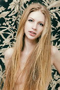 Amazing teen beauty with splendid long hair and slender flexible body poses in the nude.