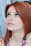 Sexy redhead naked but for her hold up stockings