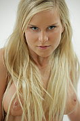 Busty blonde babe Miela A strips naked and masturbates