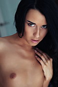 Small-breasted girl poses naked