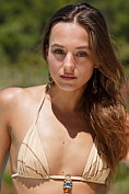 Beautiful slim girl takes off her bikini