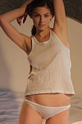 Audrey gets naked on the bed