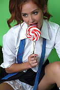 Cute brunette college girl Elle Richie stripteases with her lollipop