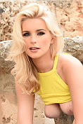 Jess Davies outdoors teasing in her yellow top