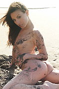 Lorena B gets gerslef all dirty posing naked on the beach