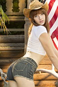 Teasing cowgirl Lena Anderson pulls up her top and takes off her denim cut-offs