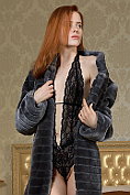 Small-breasted redhead Bella is all fur coat and lingerie